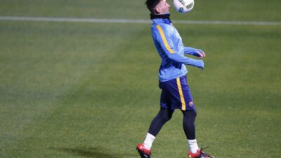 Lionel Messi of Barcelona controls the ball during training in Japan on Monday. Toru Hanai / Reuters