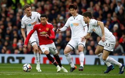 Jesse Lingard, in red, set up Alexis Sanchez for their second goal on 20 minutes, the Chilean running onto the ball and sweeping it past Lukasz Fabianski in the away net. Andrew Yates / Reuters