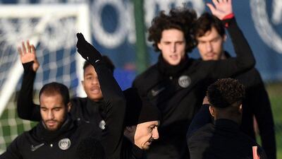 Paris Saint-Germain’s Zlatan Ibrahimovic, front, and teammates train on Monday for their Champions League match. Franck Fife / AFP