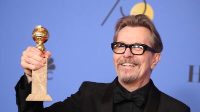 Gary Oldman poses backstage with his award for Best Performance by an Actor in a Motion Picture - Drama for'Darkest Hour. Reuters