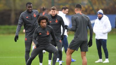 Chelsea players take part in a training session on the eve of the Champions League match against Ajax. EPA