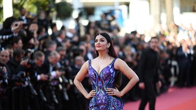 The beautiful gown features blue, purple and red detailing. AFP