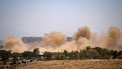 Smoke rises above eastern rebel-held areas of the city of Deraa during reported airstrikes by Syrian government on July 8, 2018. AFP