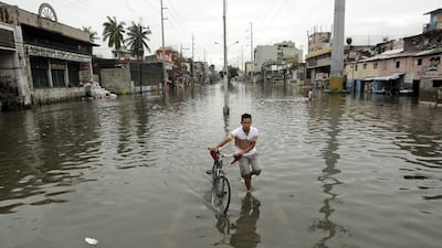 Across the country, about 350,000 people fled their homes and took shelter in evacuation centres as Typhoon Rammasun - known locally as Glenda - smashed into the Philippines on July 16, 2014. Ritchie B Tongo/EPA