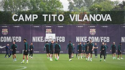 Barcelona players warm up during at FC Barcelona Sports Centre in Barcelona, Spain. David Ramos / Getty Images