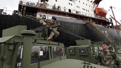 A Lebanese soldier adjusts a machine gun mounted on a military vehicle upon the arrival of a shipment of US weapons at the Beirut port on February 8, 2015. Anwar Amro/AFP Photo