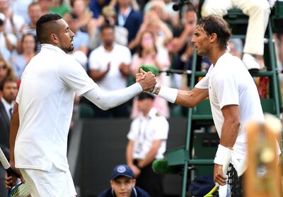 Rafael Nadal shakes hands at the net with Nick Kyrgios after winning their second-round Wimbledon clash. Getty Images