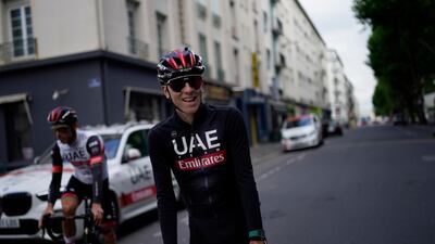 Slovenia's Tadej Pogacar smiles during a training ride, in Brest, western France. AP