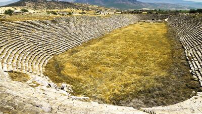 Panoramic view down the length of the ancient stadium at Aphrodisias, Turkey. This is probably the best-preserved example of this type of stadium in the Mediterranean. It is 262 m long and 59 m wide with 22 rows of seats. It had a seating capacity of about 30 000. Getty Images