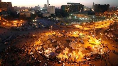 Protesters gather to demonstrate against President Mohammed Morsi in Tahrir Square. Regional businesses continue to feel the fallout from Egypt's political rivalries. Mahmoud Khaled / AFP