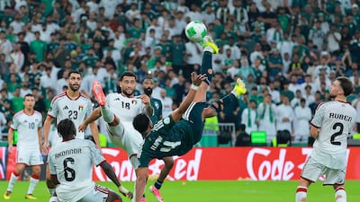 Saudi Arabia's Abdulelah Al Amri attempts an overhead-kick. Reuters