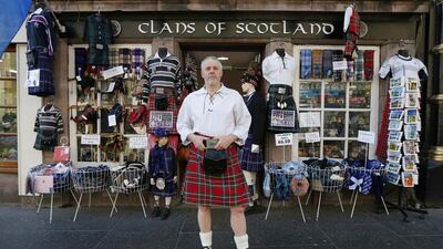 Souvenir merchant Steve Wright poses outside his shop, Clans of Scotland, in Edinburgh. Mr Wright, who plans on voting “Yes” to independence, says he thinks “The word ‘no’ should not be in the Scottish vocabulary this year.” Suzanne Plunkett / Reuters