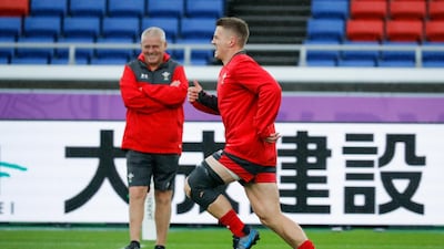 Wales head coach Warren Gatland, left, watches on as Jonathan Davies participates in training session. EPA