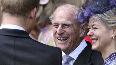 Prince Philip, Duke of Edinburgh reacts as he talks with Prince Harry, Duke of Sussex as they leave St George's Chapel in Windsor Castle, Windsor, after the wedding of Lady Gabriella Windsor and Thomas Kingston in May 2019. AFP