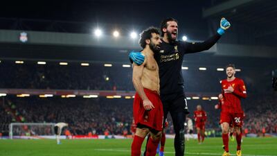 Salah is joined by Alisson. Reuters