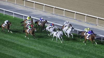 Jockey William Buick guides Ombudsman, right, to victory for Godolphin in the Dubai Turf. EPA