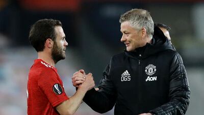 Manchester United manager Ole Gunnar Solskjaer with Juan Mata after the Europa League quarter-final win over Granada. Reuters