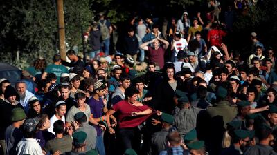 Israeli security forces scuffle with protestors as they come to evacuate 15 Jewish settler families from the illegal outpost of Netiv Haavot in the Israeli occupied West Ban. Ronen Zvulun / Reuters