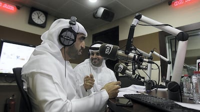 Presenters Salem Mohammed and Khalifa Al Falasi at Al Oula Radio host their live show from their studio in Dubai during Ramadan. Satish Kumar for The National