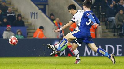 Son Heung-min of Tottenham Hotspur shoots and scores their first goal against Leicester City on Wednesday night. Darren Staples / Reuters