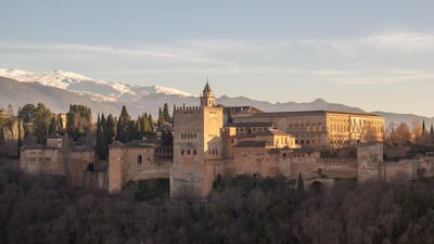The Alhambra with the snow-capped Sierra Nevada mountains in the background. Pixabay