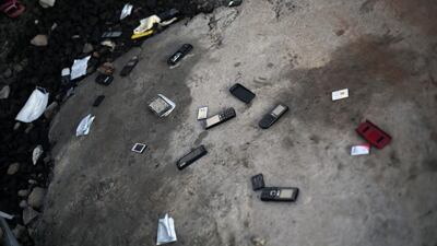 Cellphones are thrown on the ground by patients leaving the treatment unit with a clean bill of health — they discard their phones in fear that they might contain the Ebola virus.