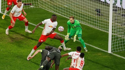 Manchester United midfielder Paul Pogba's header goes in off Leipzig's French defender Ibrahima Konate to make the score 3-2. AFP