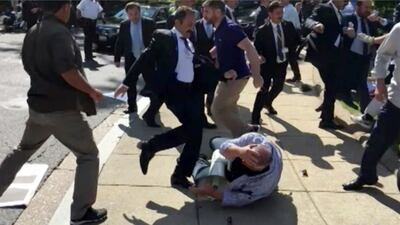 A total of 19 people were indicted for attacking protesters in May 2017. In this grab from a video provided by Voice of America, members of Turkish president Recep Tayyip Erdogan's security detail are shown violently reacting to protesters. Voice of America / The Associated Press