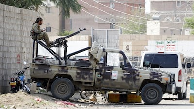 A Houthi militiaman sits behind a machine gun at a checkpoint in Sanaa, Yemen on August 27, 2017. Yahya Arhab / EPA