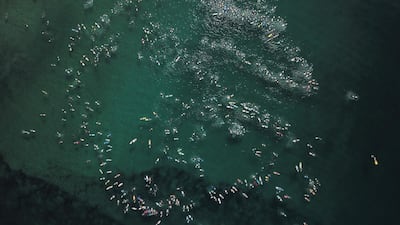 More than 600 surfers take part in a world record attempt paddle out at 'The Farm' National Surfing Reserve on the New South Wales south coast in Australia, on Saturday, May 1. EPA