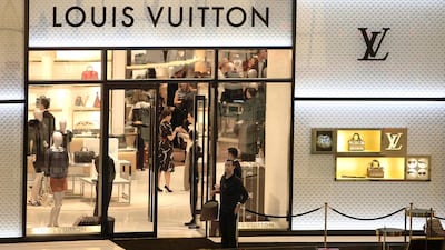 The Louis Vuitton store in Dubai Mall. Some new arrivals in the UAE become swept up in the consumer environment. Pawan Singh / The National