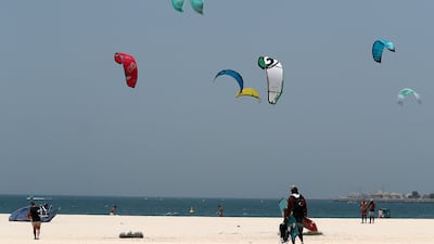 Kite surfers in action at the Kite and Surf beach in Dubai. Pawan Singh / The National