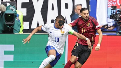 Kylian Mbappe of France and Yannick Carrasco of Belgium in action. EPA