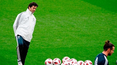 Santiago Solari, left, watches over Real Madrid forward Gareth Bale. AFP