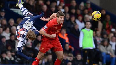 Liverpool midfielder Steven Gerrard, right, will approach facing relegation strugglers Norwich in just the same way as he would an encounter with one of the division’s heavyweights and also evoked the spirit of Liverpool’s astonishing Uefa Champions League final comeback against AC Milan in 2005 as a reference point for his team at Carrow Road. AFP PHOTO / ANDREW YATES