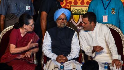 Rahul Gandhi, at the time president of the Indian National Congress Party, right, and Ms Gandhi, left, speak with Mr Singh during the Hindu festival of Dussehra, in New Delhi, 2018. AFP