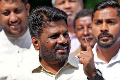 Sri Lanka's President Anura Kumara Dissanayake shows his ink-marked finger after casting his vote in Colombo. Reuters