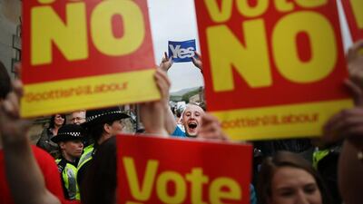 Yes campaigners stand near No supporters at Dumbarton Town Hall on Wednesday in Glasgow. Peter Macdiarmid / Getty Images