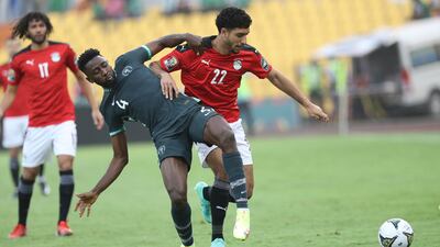 Nigeria's Wilfred Ndid and Omar Marmpush of Egypt fight for the ball. AP