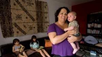 Satya Klever with her children Maia, five, Delaney, nine, and Fox, six months, at their home in Al Satwa, Dubai.