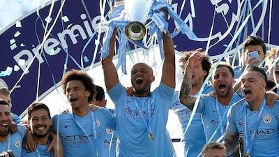 Manchester City's Vincent Kompany lifts the trophy after winning the Premier League in 2019. Reuters