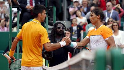 Novak Djokovic and Rafael Nadal shake hands after their meeting at the Monte Carlo Masters in April. Jean-Paul Pelissier / Reuters / April 18, 2015
