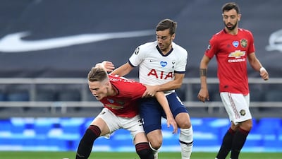 Scott McTominay tussles with Tottenham's Harry Winks. Reuters