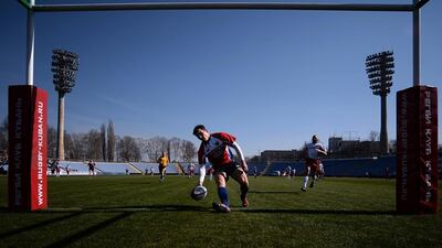A Russian rugby union player scores a try against Crimea in Simferopol on Saturday. Filippo Monteforte / AFP / March 15, 2014
