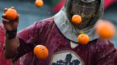A person participates in the annual 'Battle of the Oranges' in the northern city of Ivrea, Italy February 19, 2023. REUTERS / Massimo Pinca