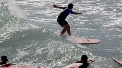 A beginner during a surf lesson conducted by Surf Shop Arabia in Dubai. Courtesy Surf Shop Arabia