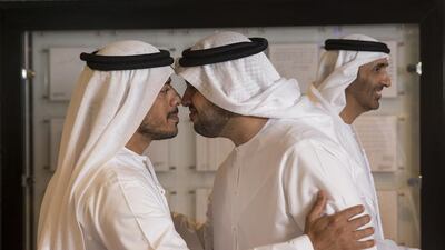 Sheikh Sultan bin Tahnoon, Abu Dhabi Executive Council Member, greets Sheikh Diab bin Mohammed bin Zayed, during a mass wedding reception at the Armed Forces Officers Club. Sheikh Saeed bin Zayed, Abu Dhabi Ruler’s Representative, is seen in the background. Ryan Carter / Crown Prince Court — Abu Dhabi