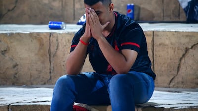 Another Al Ahly fan holds his head in his hands following the 2-0 defeat. Reuters