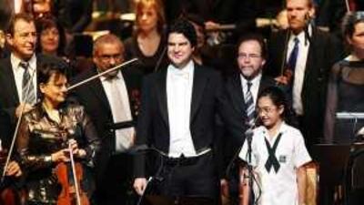 The conductor Markus Huber and the vocal soloist Dorsa Bayat at The Lord of the Rings Symphony concert Friday.