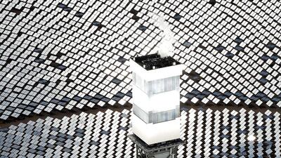 Some of the 300,000 computer-controlled mirrors, each about 7 feet high and 10 feet wide, reflect sunlight to boilers that sit on 459-foot towers. Chris Carlson / AP Photo